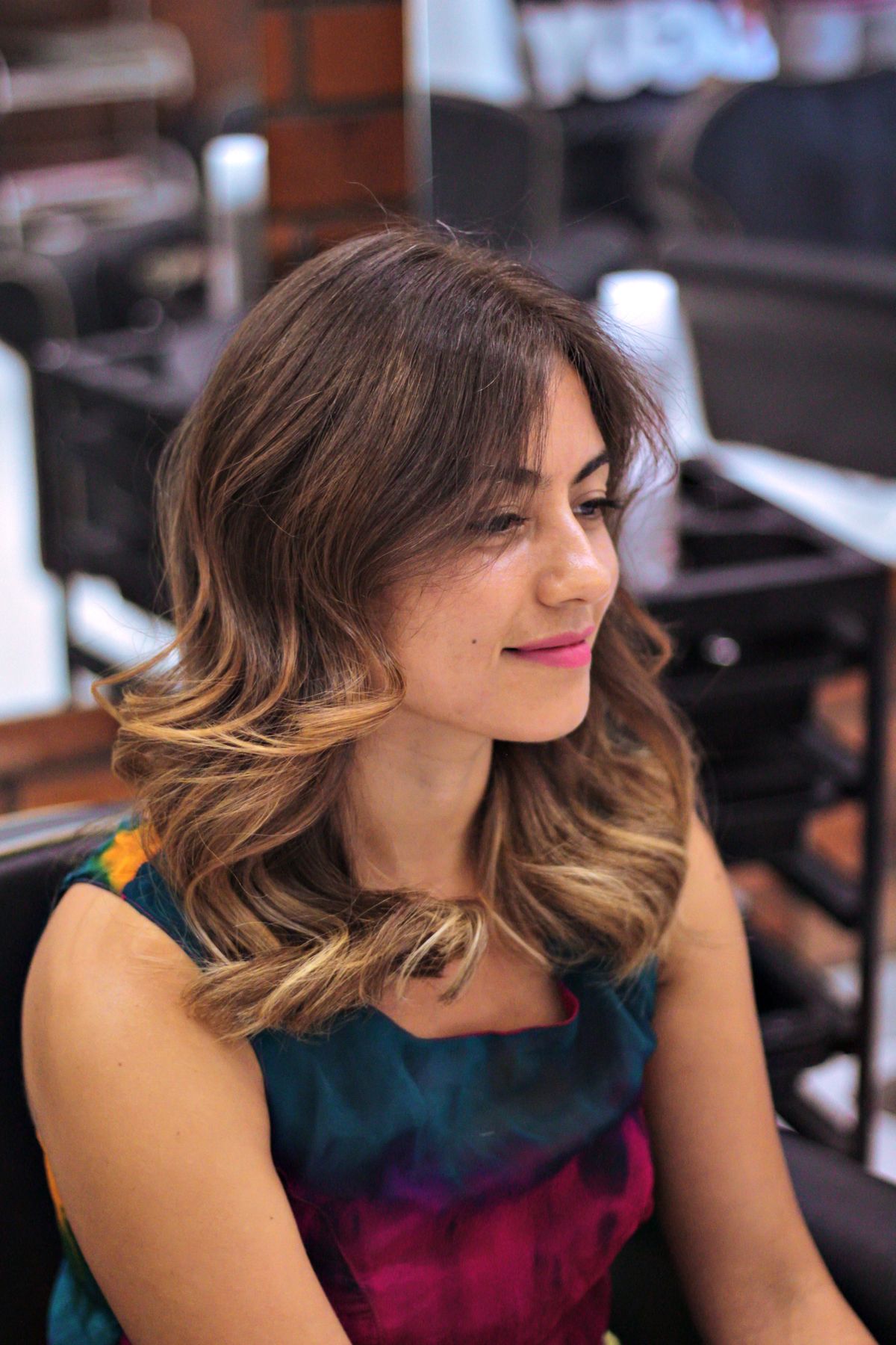 A guest's finished balayage catching the studio light