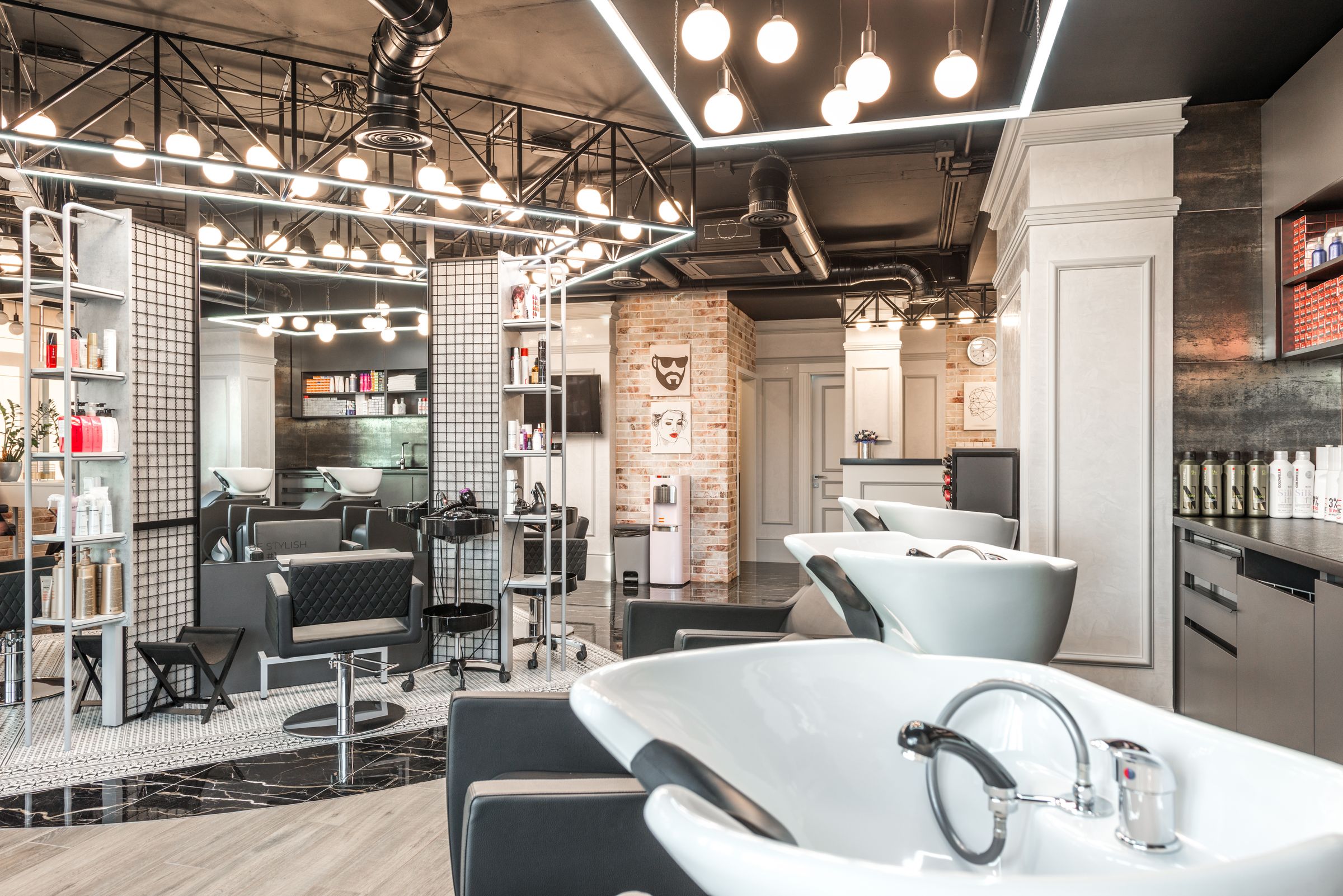 Industrial-chic styling stations and backwash chairs at Velina