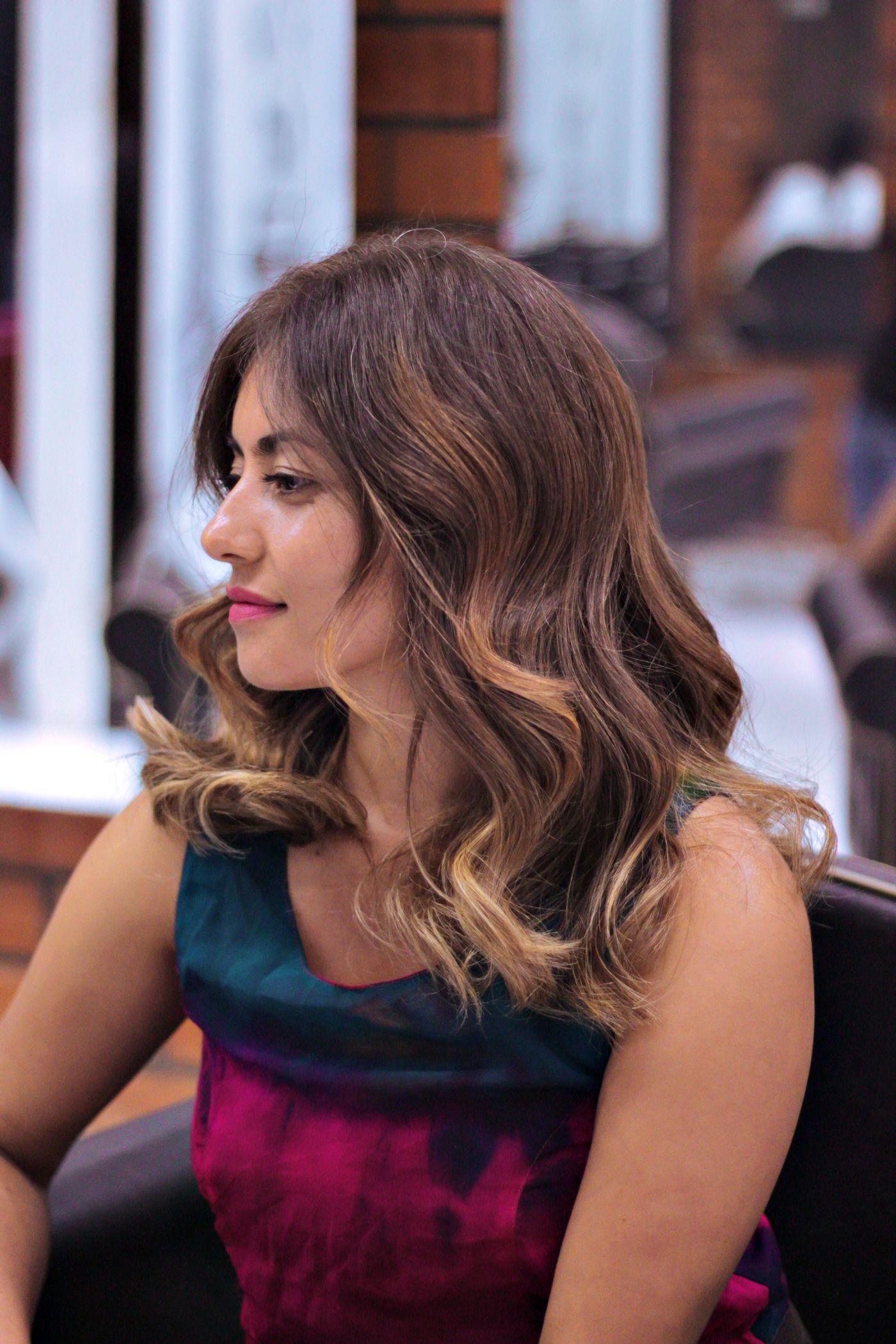 Guest with freshly styled balayage waves