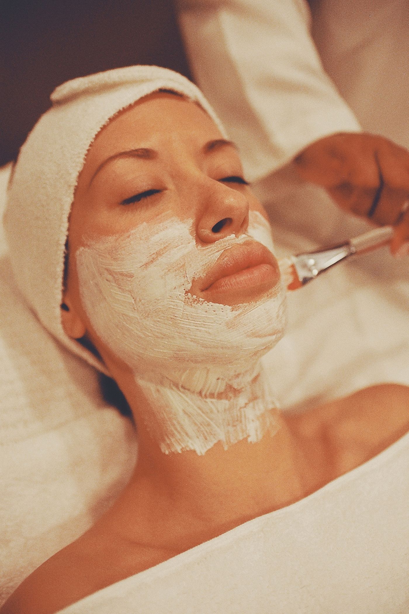 Guest relaxing during a hydrating facial mask treatment
